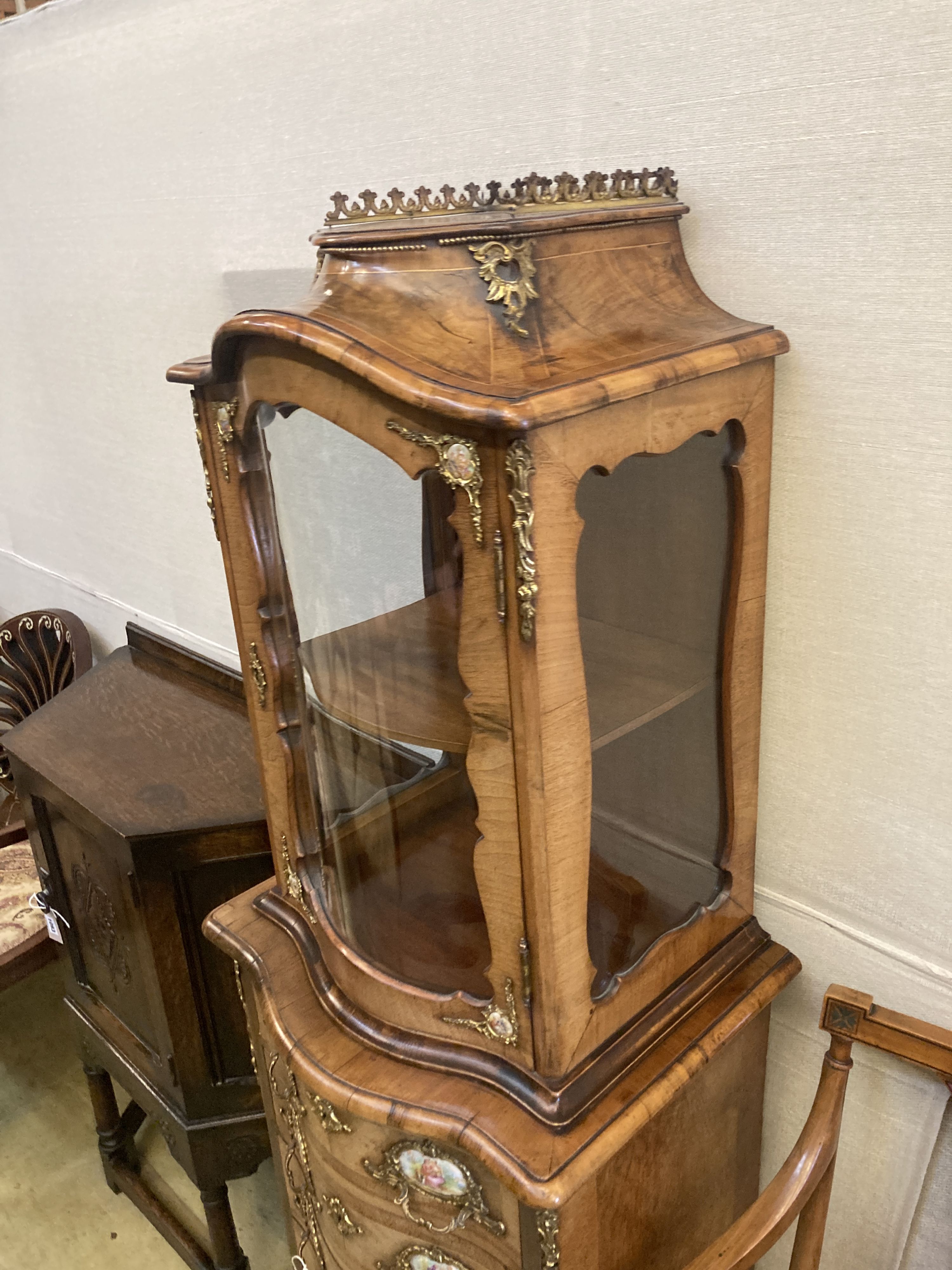 A small Louis XV style kingwood and walnut serpentine vitrine on commode base, width 49cm, depth 40cm, height 146cm